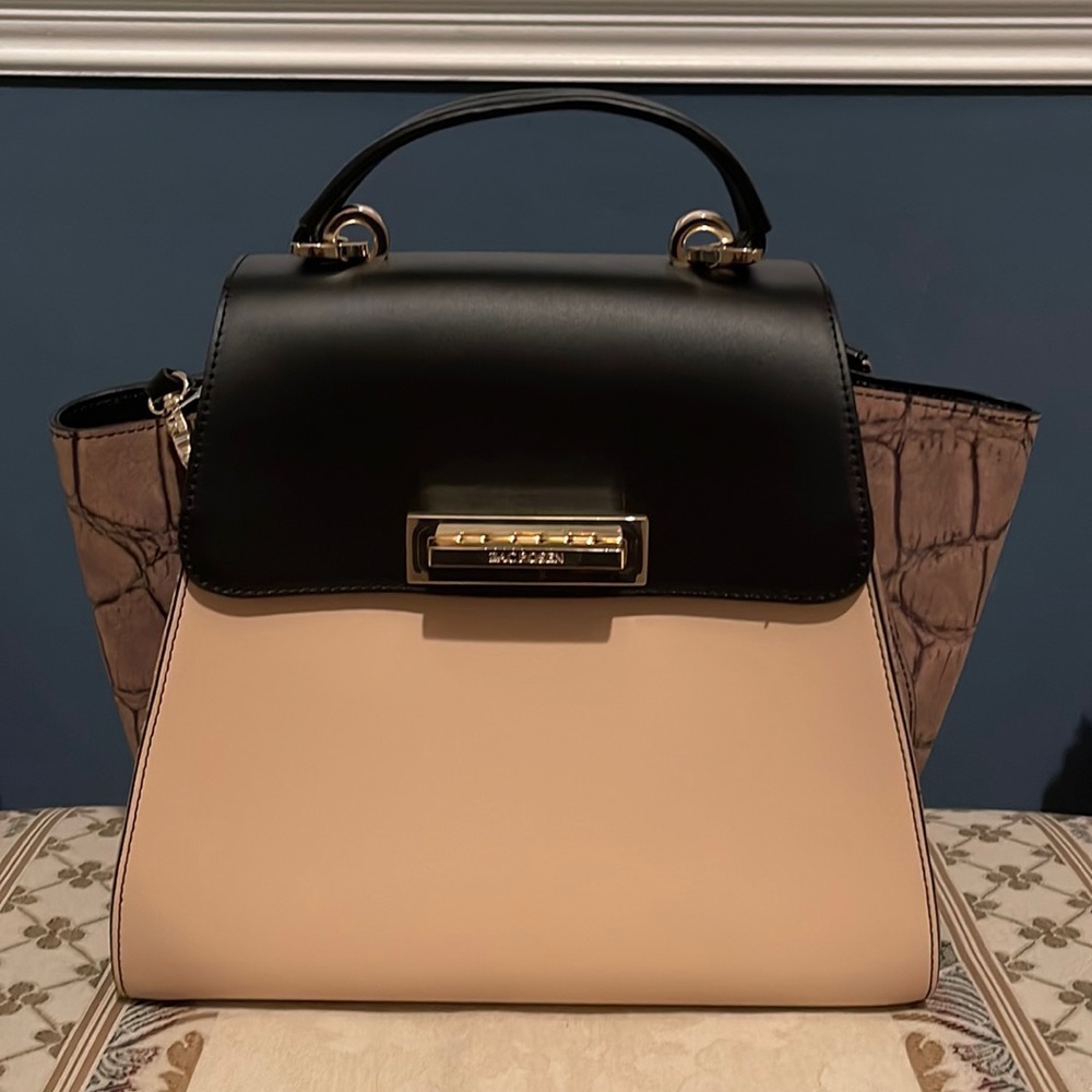 designer hand bag never been used real leather no defects willing to negotiate